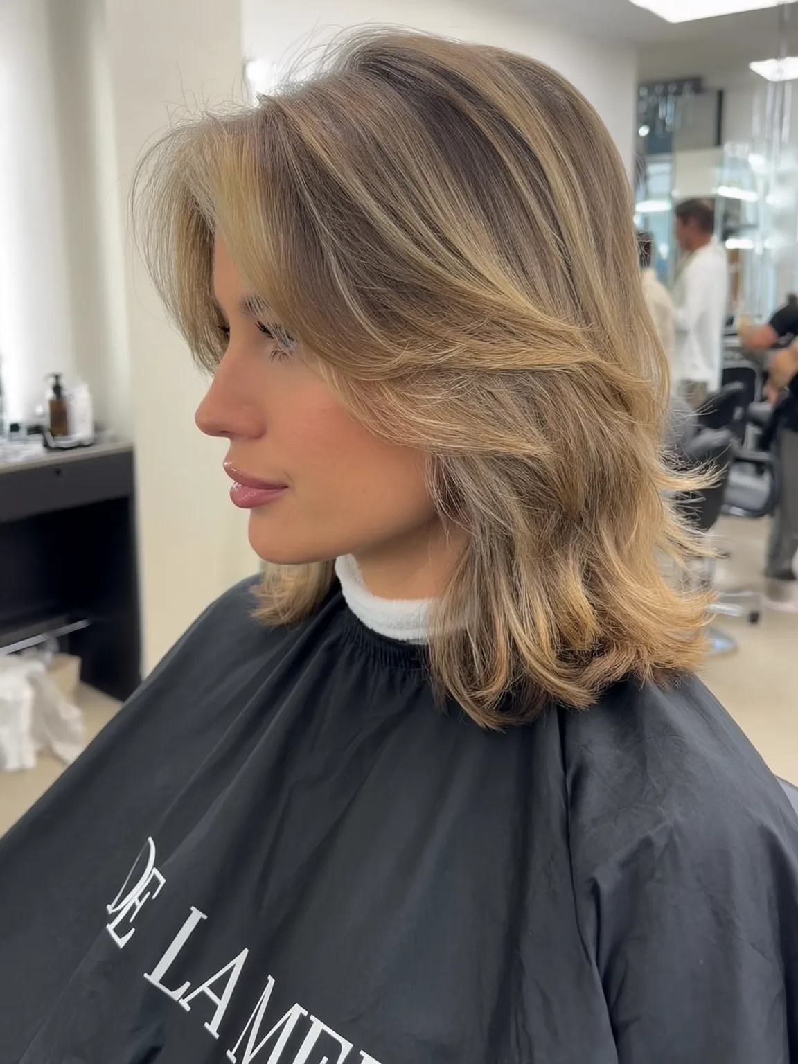 Shoulder-Length Layered Cut with Sandy Blonde Babylights